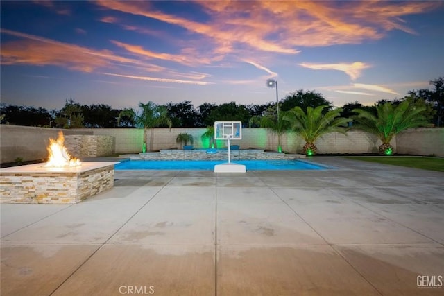 12312 Ashlyn Dr, Bakersfield, CA 93311 - view of pool with an outdoor fire pit, a patio area, and a fenced backyard