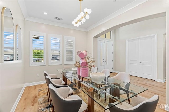 12312 Ashlyn Dr, Bakersfield, CA 93311 - dining room with arched walkways, wood finished floors, crown molding, baseboards, and recessed lighting