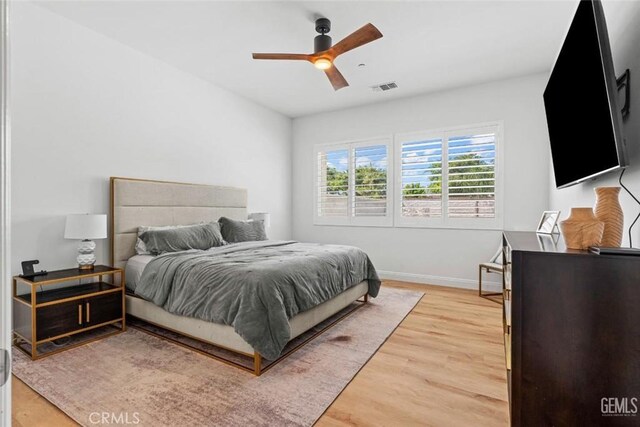 12312 Ashlyn Dr, Bakersfield, CA 93311 - bedroom featuring light wood-style flooring, baseboards, and a ceiling fan