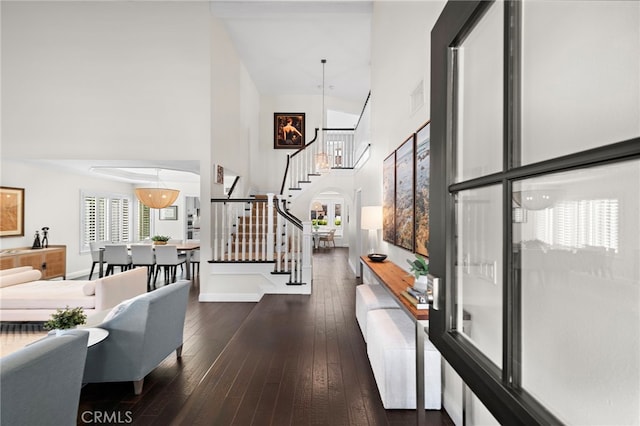 23982 Cormorant Ln, Laguna Niguel, CA 92677 - entrance foyer featuring stairway, a towering ceiling, dark wood finished floors, and baseboards