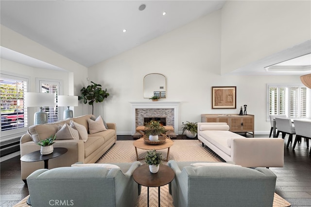 23982 Cormorant Ln, Laguna Niguel, CA 92677 - living room featuring wood-type flooring, high vaulted ceiling, recessed lighting, baseboards, and a stone fireplace