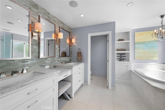23982 Cormorant Ln, Laguna Niguel, CA 92677 - bathroom featuring double vanity, a bath, toilet, tasteful backsplash, and tile patterned flooring