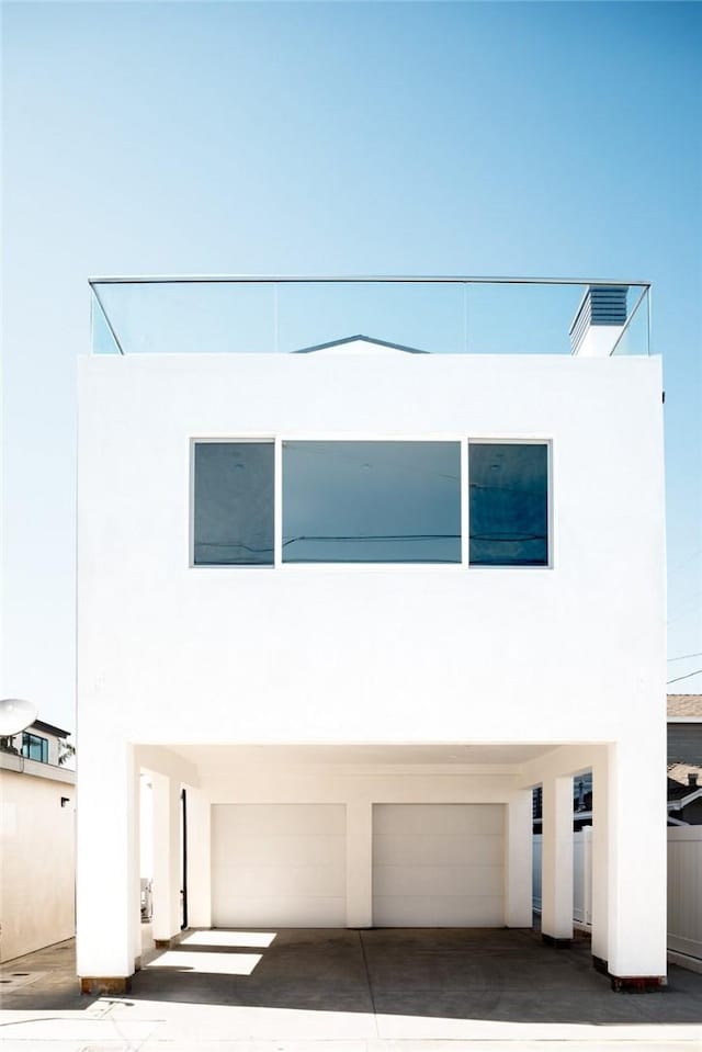 312 35th St, Newport Beach, CA 92663 - view of front of property featuring a garage and stucco siding