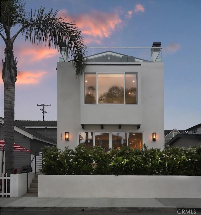 312 35th St, Newport Beach, CA 92663 - back of house at dusk with stucco siding