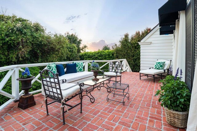 7716 Lookout Dr, La Jolla, CA 92037 - patio terrace at dusk with an outdoor living space