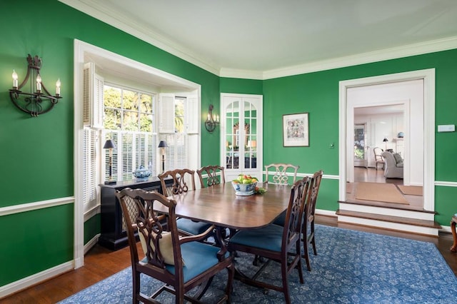 7716 Lookout Dr, La Jolla, CA 92037 - dining space featuring a chandelier, ornamental molding, wood finished floors, and baseboards