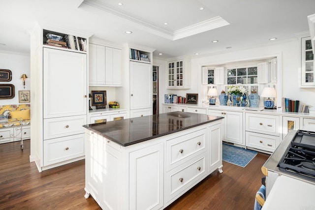 7716 Lookout Dr, La Jolla, CA 92037 - kitchen featuring ornamental molding, white cabinets, glass insert cabinets, dark wood-type flooring, and a raised ceiling