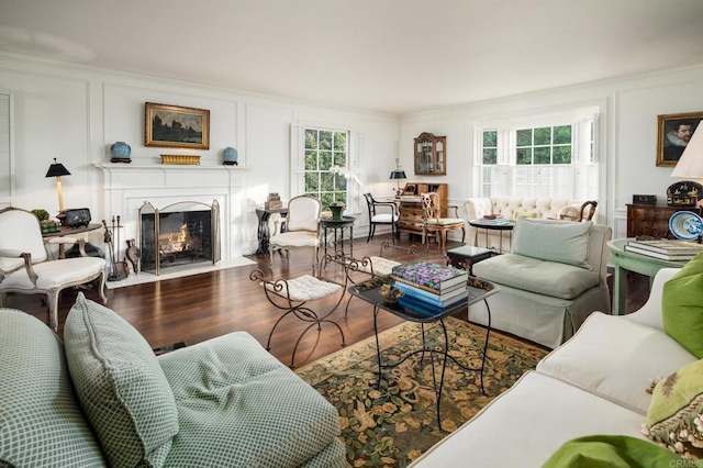 7716 Lookout Dr, La Jolla, CA 92037 - living area with a decorative wall, ornamental molding, a fireplace with flush hearth, and wood finished floors