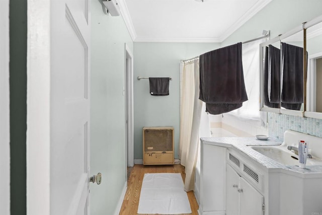 321 E Meda Ave, Glendora, CA 91741 - laundry room with ornamental molding, a sink, and light wood-style flooring