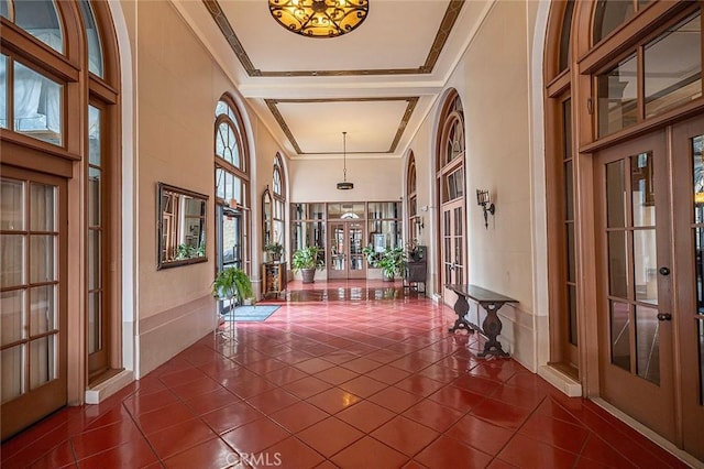 455 E Ocean Blvd Unit 715, Long Beach, CA 90802 - foyer entrance with french doors, dark tile patterned flooring, and crown molding