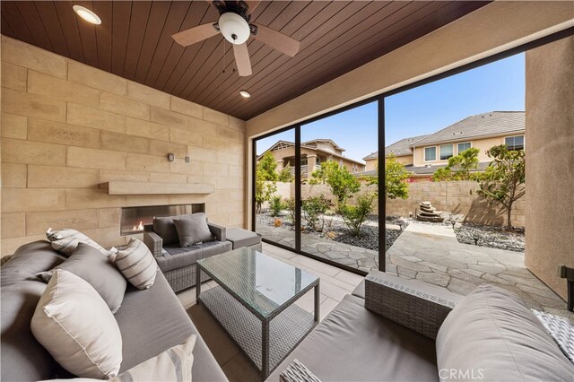 72 Crater, Irvine, CA 92618 - living area featuring ceiling fan, wooden ceiling, recessed lighting, and an outdoor stone fireplace