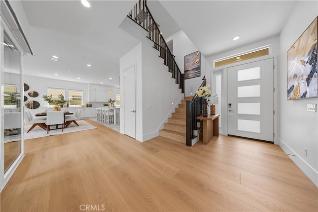 72 Crater, Irvine, CA 92618 - entrance foyer featuring light wood-type flooring, stairway, recessed lighting, and baseboards
