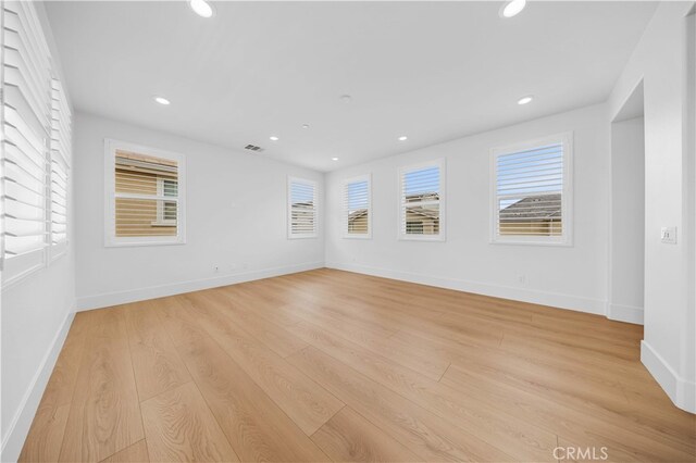 72 Crater, Irvine, CA 92618 - unfurnished room featuring plenty of natural light, light wood finished floors, recessed lighting, and baseboards