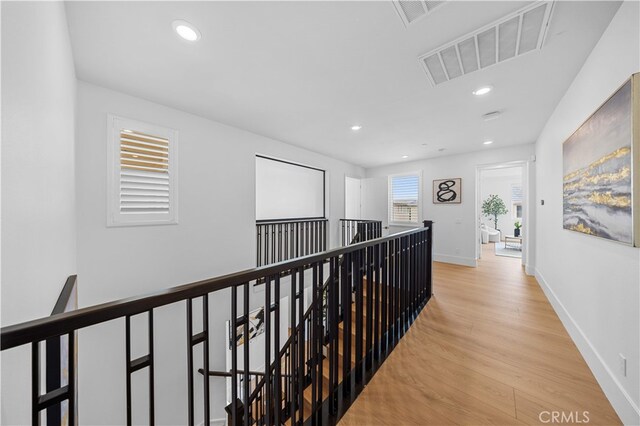 72 Crater, Irvine, CA 92618 - hallway featuring an upstairs landing, wood finished floors, recessed lighting, and baseboards