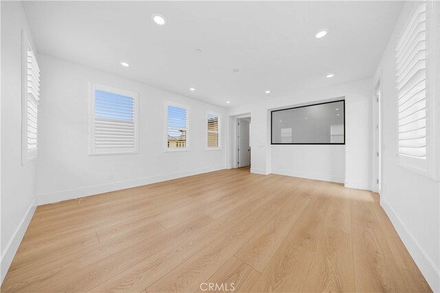 72 Crater, Irvine, CA 92618 - empty room with light wood finished floors, recessed lighting, and baseboards