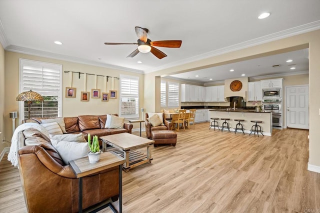 2185 Twain Ave, Carlsbad, CA 92008 - living area with ceiling fan, baseboards, light wood finished floors, ornamental molding, and recessed lighting