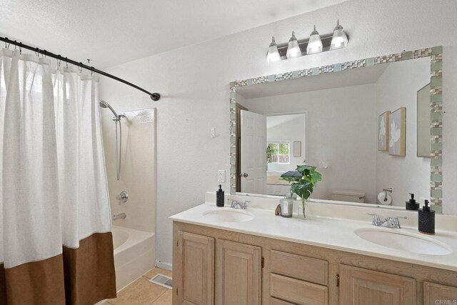4938 Dulin Rd, Fallbrook, CA 92028 - bathroom featuring shower / bath combo with shower curtain, double vanity, and tile patterned flooring