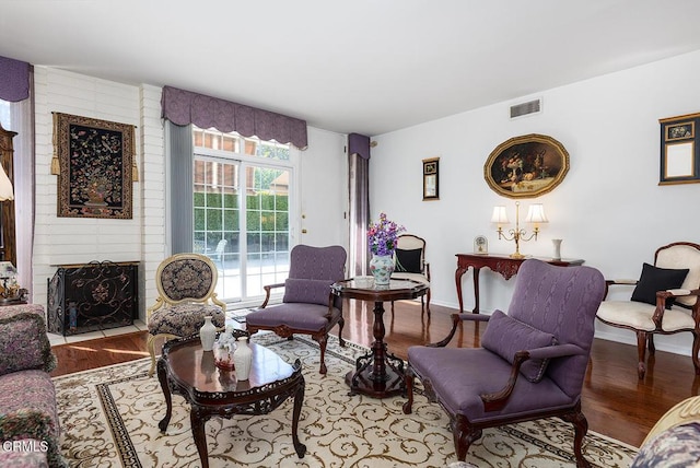 848 S Orange Grove Blvd, Pasadena, CA 91105 - living area with wood finished floors, a large fireplace, and baseboards