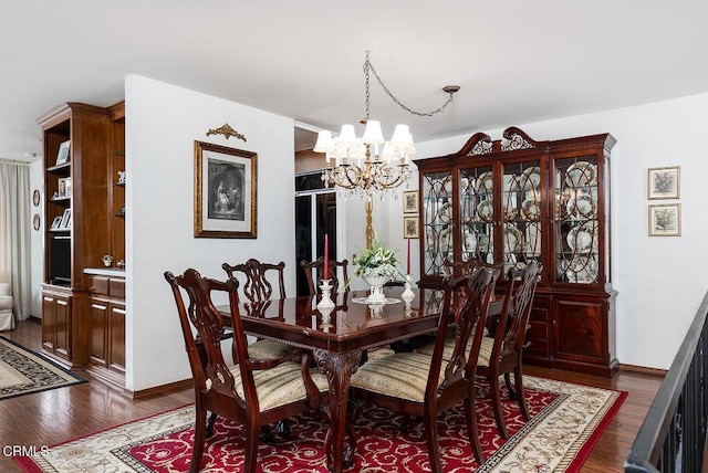 848 S Orange Grove Blvd, Pasadena, CA 91105 - dining room featuring a chandelier, dark wood-style floors, and baseboards