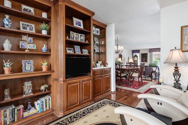848 S Orange Grove Blvd, Pasadena, CA 91105 - living area with dark wood-style floors, a chandelier, and built in features