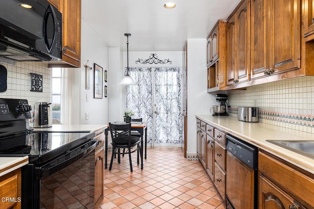 848 S Orange Grove Blvd, Pasadena, CA 91105 - kitchen featuring black appliances, light countertops, backsplash, and brown cabinetry