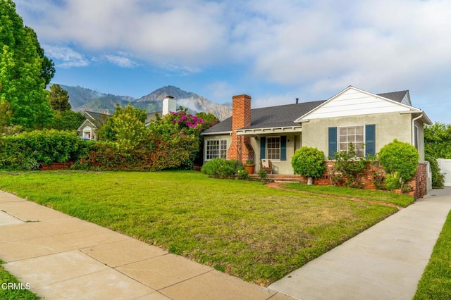 1736 Craig Ave, Altadena, CA 91001 - view of front facade featuring a front lawn, a chimney, stucco siding, a mountain view, and a shingled roof