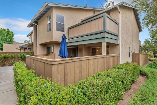 10264 Michala Pl, Santee, CA 92071 - rear view of house featuring a balcony and stucco siding