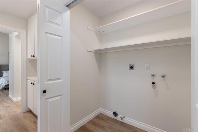 1208 Via Viento Suave, San Marcos, CA 92078 - laundry area featuring hookup for a gas dryer, light wood-type flooring, hookup for a washing machine, and baseboards