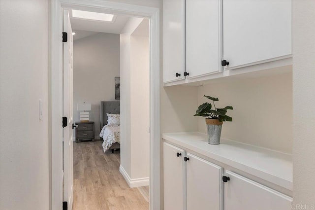 1208 Via Viento Suave, San Marcos, CA 92078 - hall featuring light wood-style flooring, a skylight, and baseboards