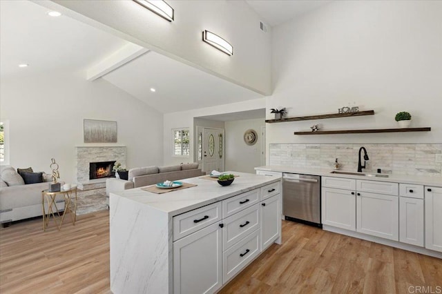 1208 Via Viento Suave, San Marcos, CA 92078 - kitchen featuring stainless steel dishwasher, a sink, light wood-style floors, tasteful backsplash, and recessed lighting