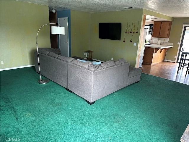 37824 Queensboro Ct, Palmdale, CA 93552 - living room featuring a textured ceiling, carpet floors, and baseboards