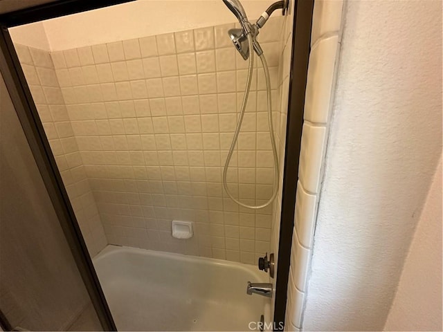 37824 Queensboro Ct, Palmdale, CA 93552 - bathroom with shower / tub combination and a textured wall