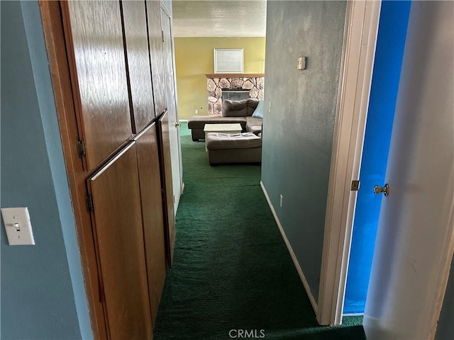 37824 Queensboro Ct, Palmdale, CA 93552 - hallway featuring dark colored carpet and baseboards