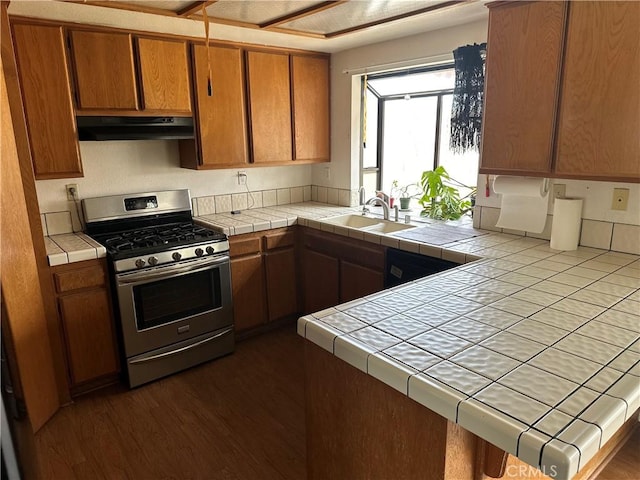 37824 Queensboro Ct, Palmdale, CA 93552 - kitchen with gas range, tile countertops, range hood, a peninsula, and a sink