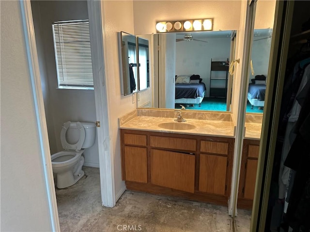 37824 Queensboro Ct, Palmdale, CA 93552 - ensuite bathroom featuring vanity, ceiling fan, toilet, concrete floors, and a closet