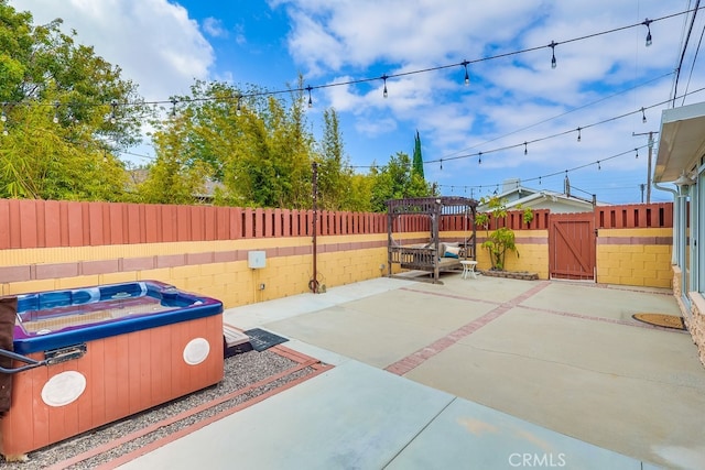 2818 W 166th St, Torrance, CA 90504 - fenced backyard featuring a patio, a gate, and a hot tub