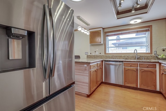 2818 W 166th St, Torrance, CA 90504 - kitchen featuring stainless steel appliances, light wood-style floors, crown molding, pendant lighting, and track lighting