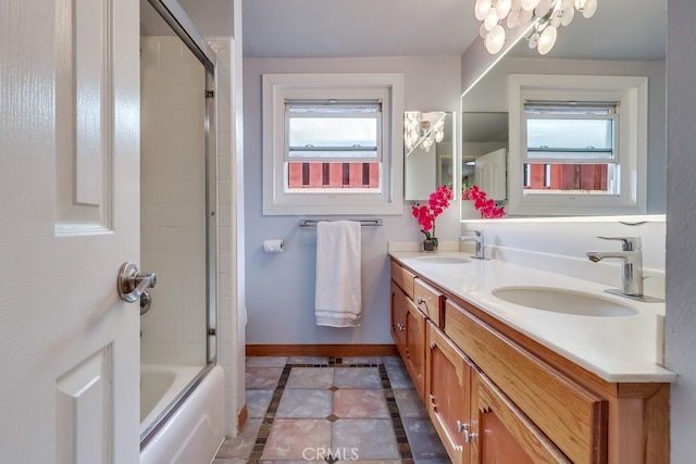 2818 W 166th St, Torrance, CA 90504 - full bath with inlaid floor details, plenty of natural light, double vanity, and enclosed tub / shower combo
