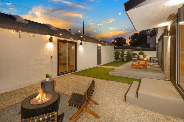 3852 Bledsoe Ave, Los Angeles, CA 90066 - patio terrace at dusk featuring a fire pit, a patio, and a wooden deck