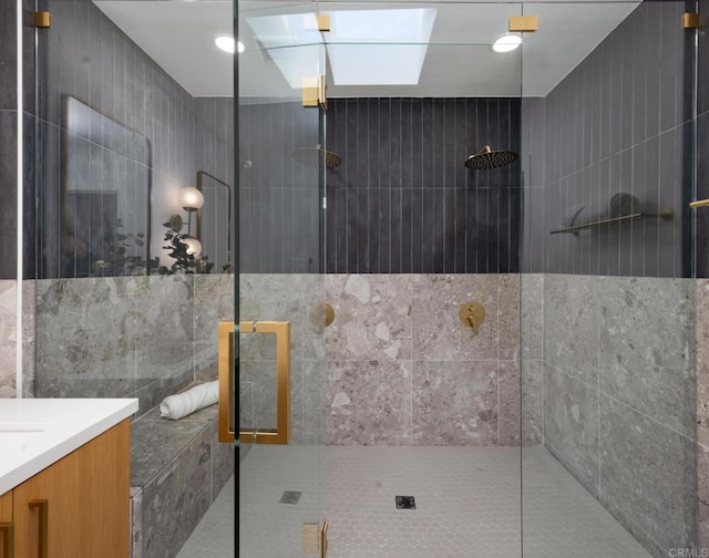 3852 Bledsoe Ave, Los Angeles, CA 90066 - bathroom with walk in shower, a skylight, vanity, and tile walls