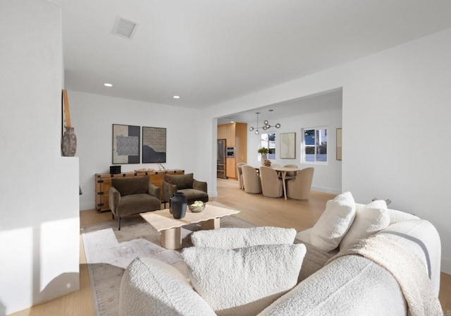 3852 Bledsoe Ave, Los Angeles, CA 90066 - living room with a chandelier, light wood-style flooring, and recessed lighting