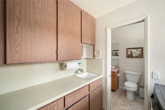 6058 Joan Pl, San Luis Obispo, CA 93401 - kitchen with light countertops, range, and light tile patterned floors