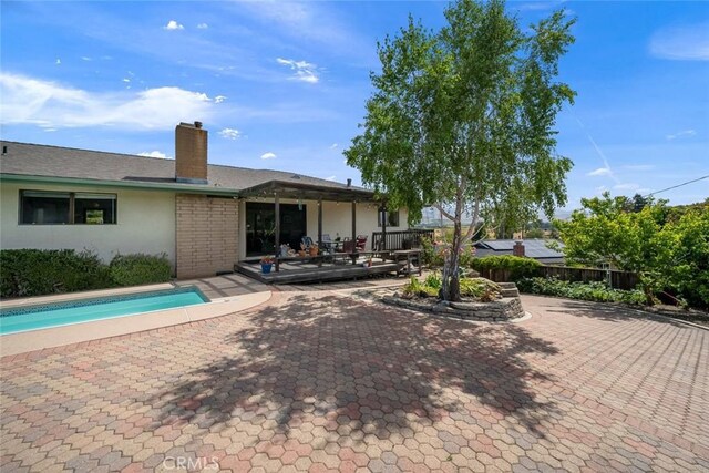 6058 Joan Pl, San Luis Obispo, CA 93401 - back of property featuring a patio area, a chimney, and stucco siding