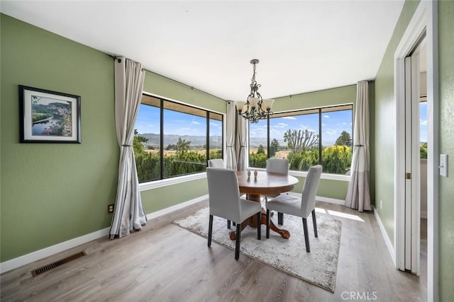 6058 Joan Pl, San Luis Obispo, CA 93401 - dining room featuring a chandelier and wood finished floors