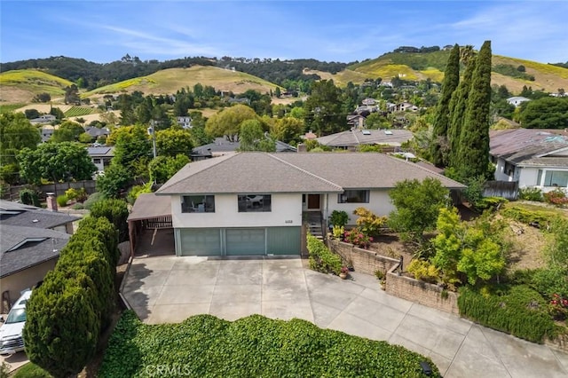 6058 Joan Pl, San Luis Obispo, CA 93401 - view of front of home with a garage, driveway, stucco siding, a residential view, and a mountain view