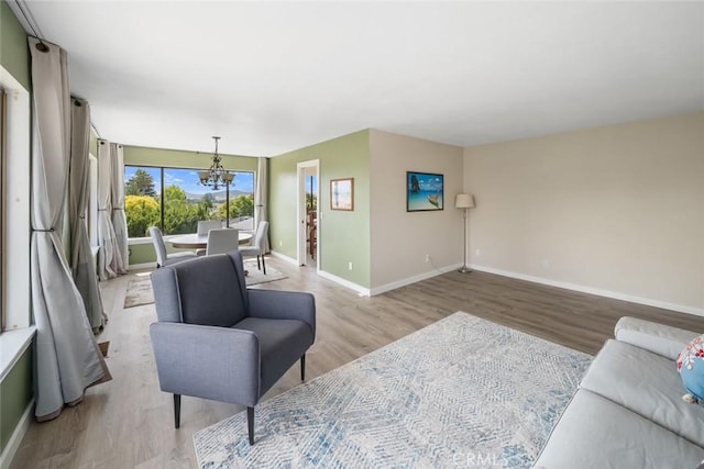 6058 Joan Pl, San Luis Obispo, CA 93401 - living room featuring a chandelier and light wood-type flooring