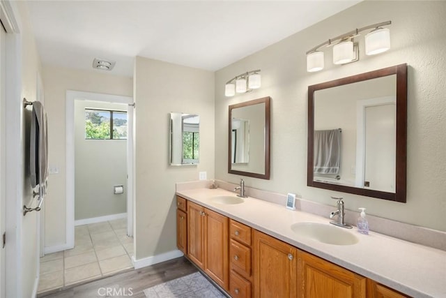 6058 Joan Pl, San Luis Obispo, CA 93401 - full bath featuring double vanity and wood finished floors