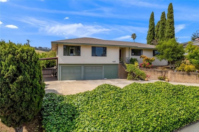 6058 Joan Pl, San Luis Obispo, CA 93401 - ranch-style house featuring an attached garage, stucco siding, and concrete driveway