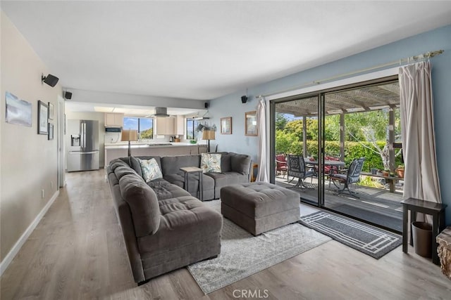 6058 Joan Pl, San Luis Obispo, CA 93401 - living area with light wood-style flooring and baseboards