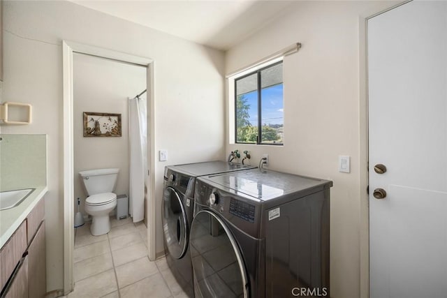 6058 Joan Pl, San Luis Obispo, CA 93401 - washroom with washing machine and clothes dryer and light tile patterned flooring